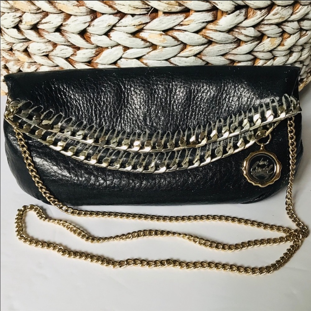 Henry Bendel small black leather clutch.